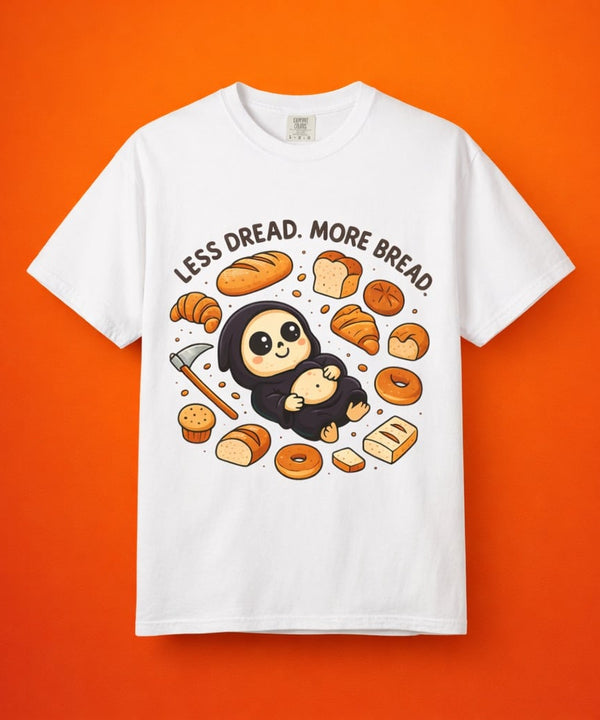 White graphic t-shirt flat lay on orange background featuring cute reaper art.