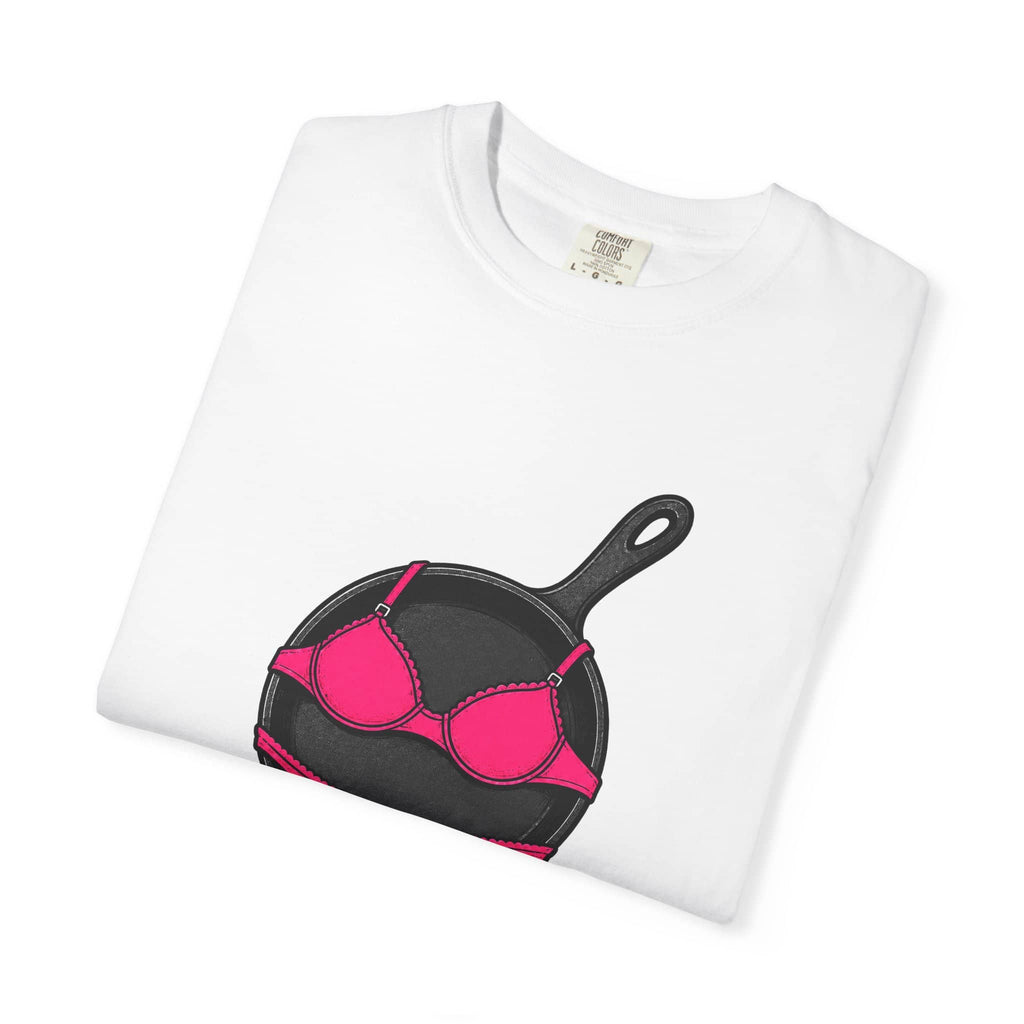 Folded white Comfort Colors t-shirt featuring a cast iron pan wearing a pink bra and the word Pansexual.
