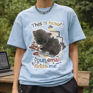 Model wearing an oversized light blue t-shirt with a funny corporate burnout dog design outdoors.