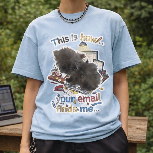 Studio shot of the funny email meme shirt on a purple background, highlighting the graphic detail.