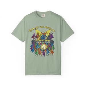 A sage green Comfort Colors t-shirt featuring the "Open Up The Moth Pit" graphic, which depicts a colorful heavy metal band of moths performing on stage for a swarming crowd holding a giant lightbulb.