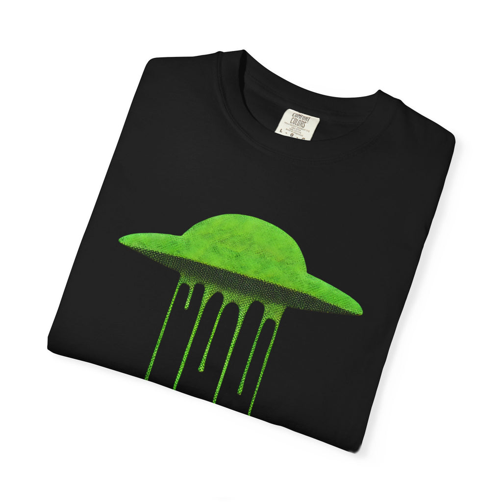 A folded black Comfort Colors t-shirt featuring the vibrant lime green melting UFO graphic