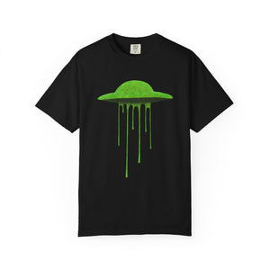Front view of a black t-shirt featuring a vibrant, lime green melting UFO illustration on a plain background