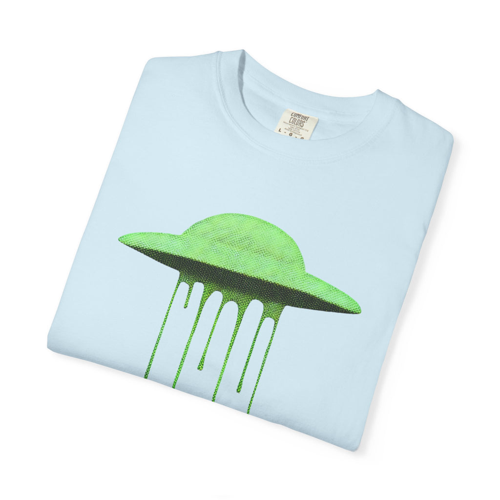 A folded light blue Comfort Colors t-shirt with a neon green dripping UFO design on the front