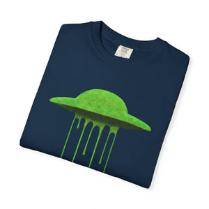 A folded navy blue Comfort Colors t-shirt showing the neon green dripping UFO graphic on the front