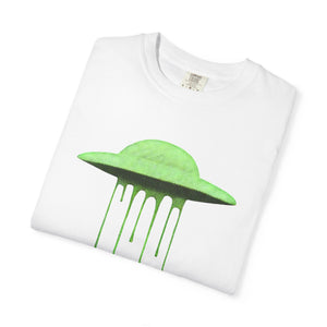 A folded white Comfort Colors t-shirt displaying the neon green dripping UFO design on the front