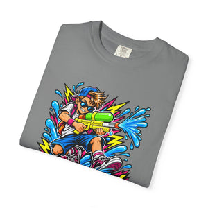 A folded gray crewneck t-shirt featuring a colorful graphic print of a cartoon boy holding a green and yellow water gun with blue splashes and lightning bolts.