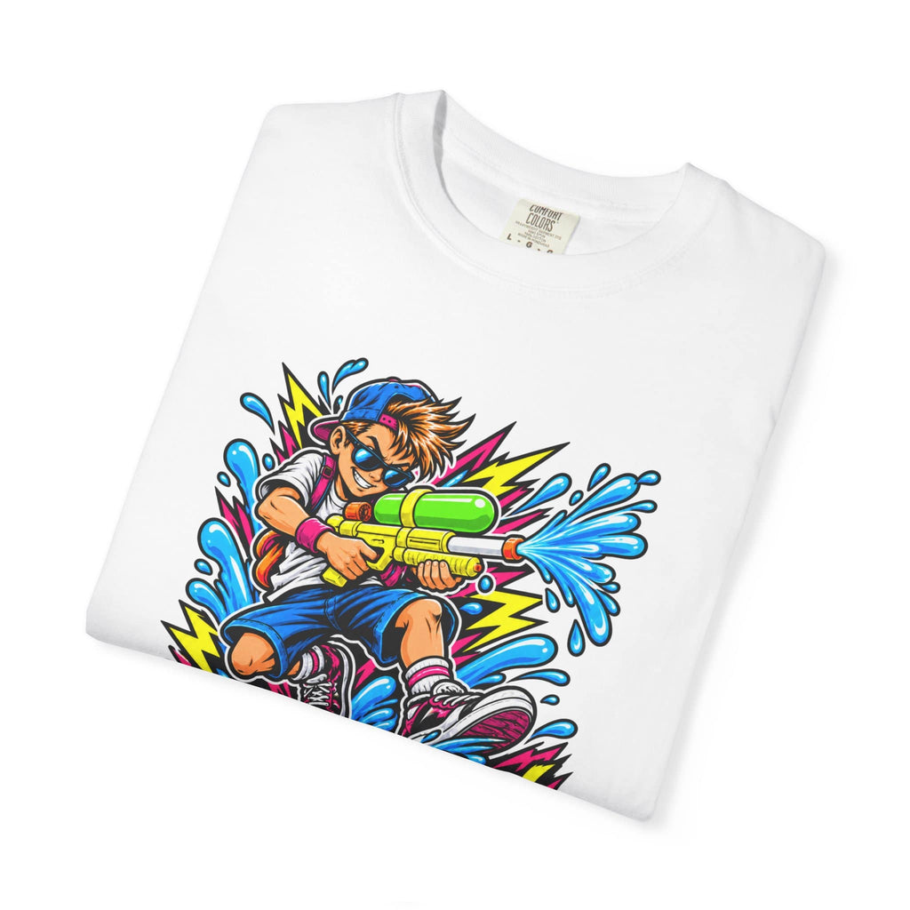 A folded white crewneck t-shirt featuring a vibrant, colorful graphic print of a cartoon boy aiming a water gun amidst splashing water and lightning bolts.