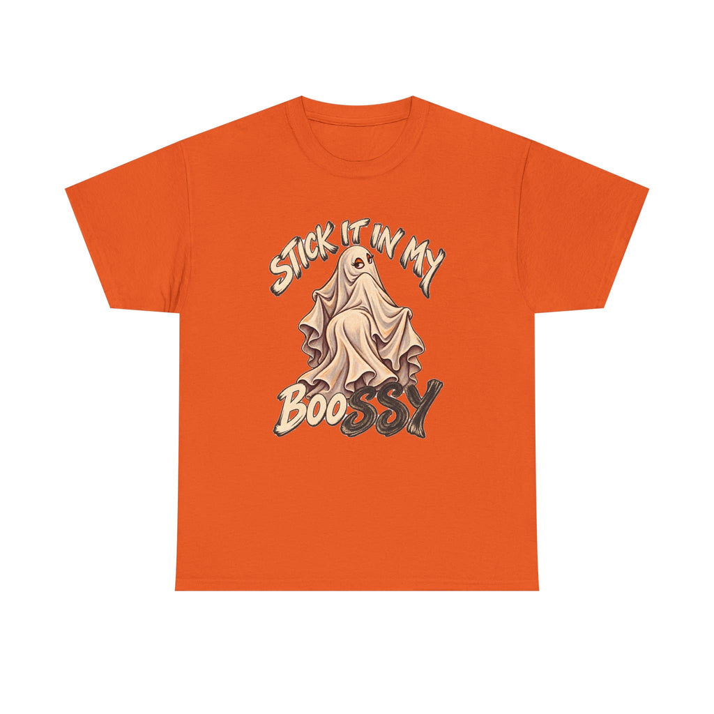 An orange short-sleeve crewneck t-shirt featuring a graphic of a ghostly figure draped in a sheet with the text 'STICK IT IN MY BOOSSY' in stylized lettering.