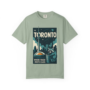 Blue Spruce green t-shirt with a graphic of a raccoon and the text Where Trash Meets Class.