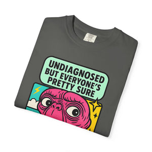 Folded pepper purple t-shirt with retro pop-art alien illustration.