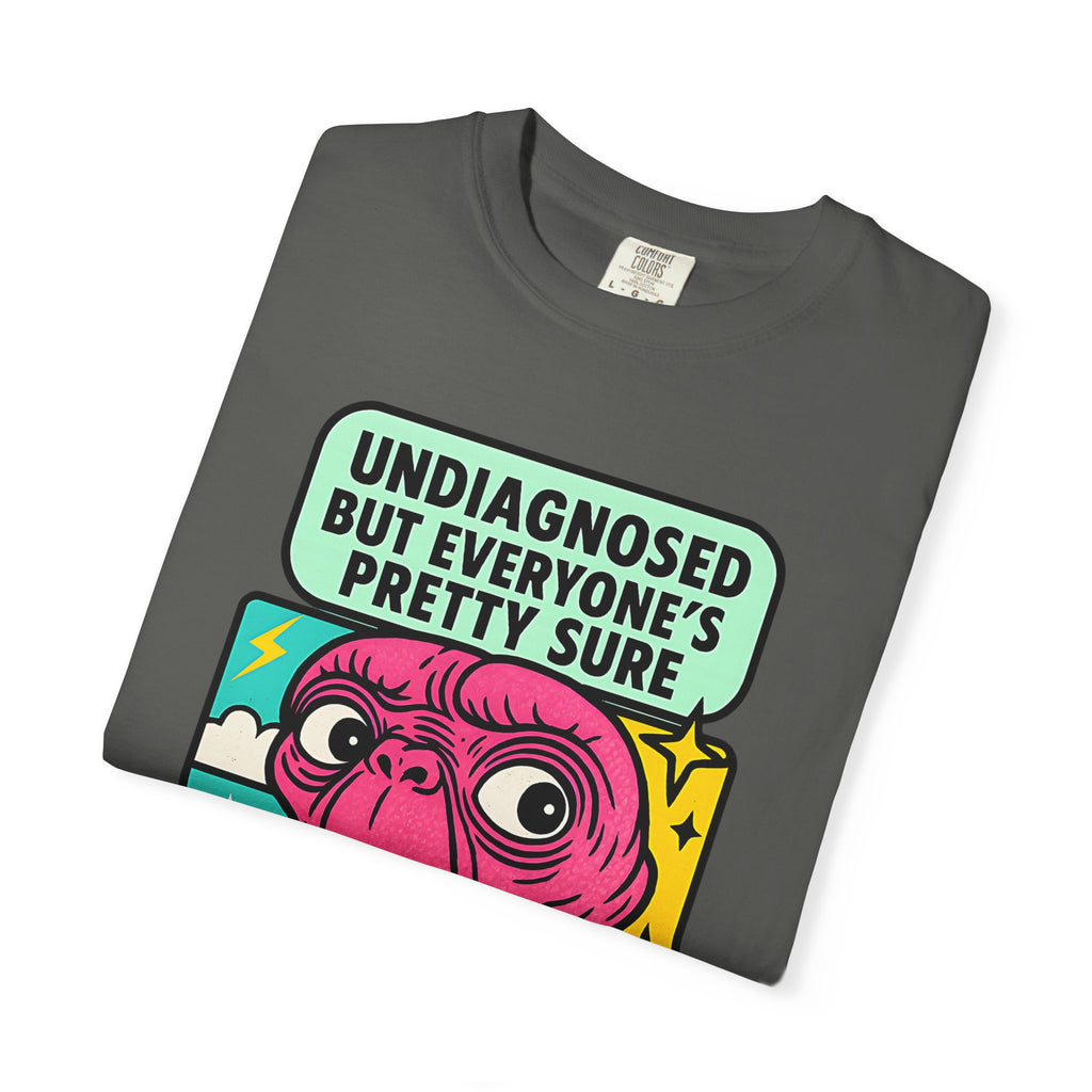 Folded pepper purple t-shirt with retro pop-art alien illustration.