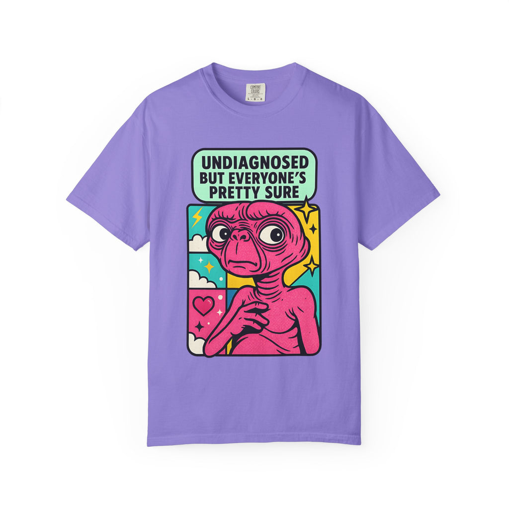 Folded violet purple t-shirt with retro pop-art alien illustration.