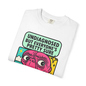 Folded white purple t-shirt with retro pop-art alien illustration.