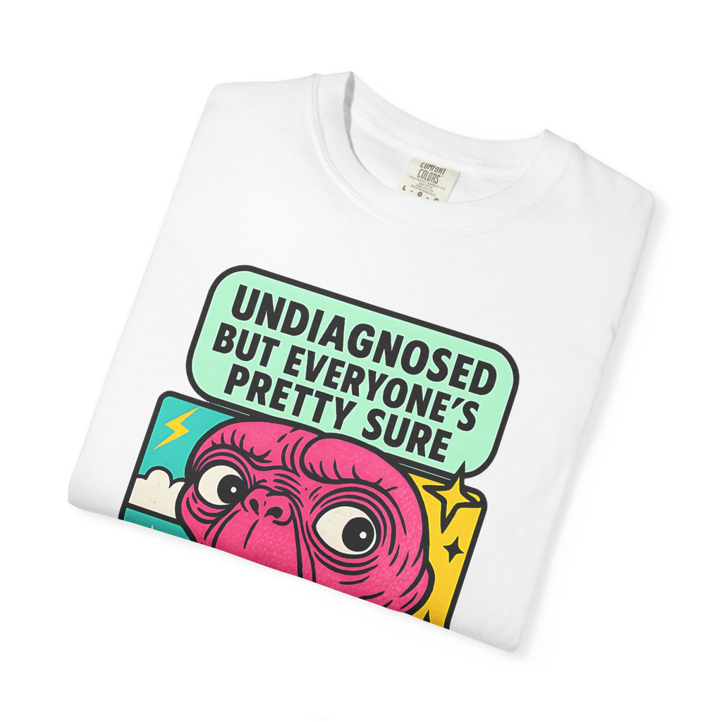 Folded white purple t-shirt with retro pop-art alien illustration.