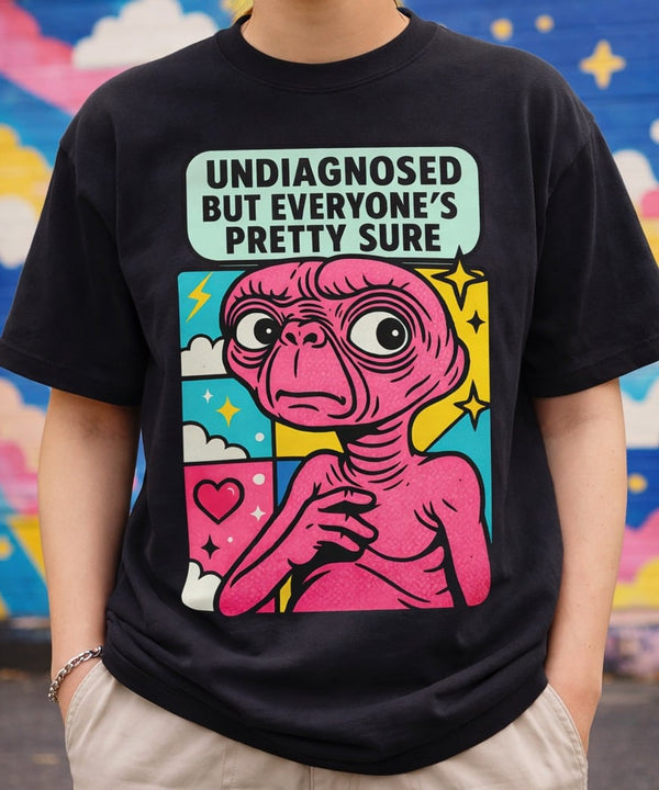 Model wearing the "Undiagnosed But Everyone's Pretty Sure" black t-shirt, street style look.