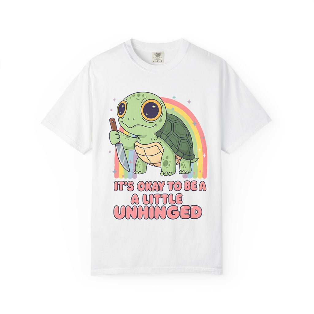 White t-shirt featuring a cute green turtle holding a knife with the text "It's Okay To Be A Little Unhinged".