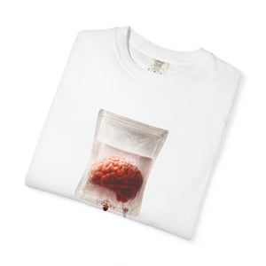 A neatly folded white t-shirt featuring a graphic of a brain inside an IV drip bag on the front