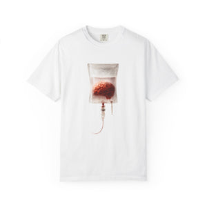 A white t-shirt laid flat, showcasing the surreal brain inside an IV drip bag graphic on the front